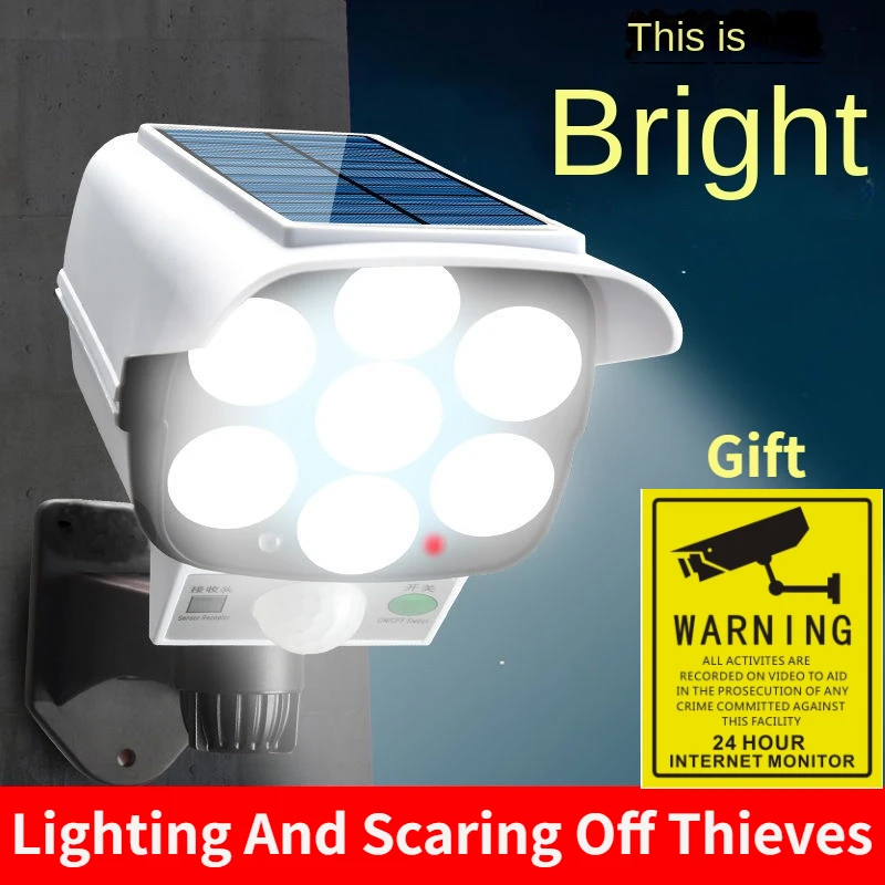 Home Security And Monitoring - 屋外ソーラーライトモーションセンサーセキュリティダミーカメラワイヤレスフラッドライトIP65防水77 LEDランプ3モード家庭菜園用